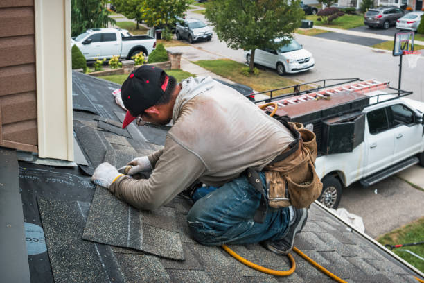 Professional Roofing technician working in Evans, WA